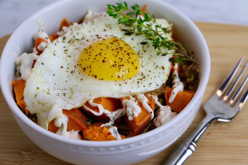 Buckwheat Breakfast Bowl with Savory Roasted Veggies, a Garlic Lemon Tahini Sauce, and a Fried Egg on top! This bowl is healthy, gluten-free, and vegetarian. Make it vegan by removing the egg.